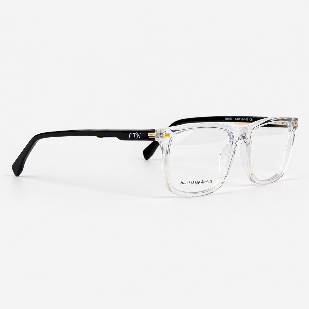 Gafas de acetato frontal transparente con varillas negras y apliques metalicos Piclek