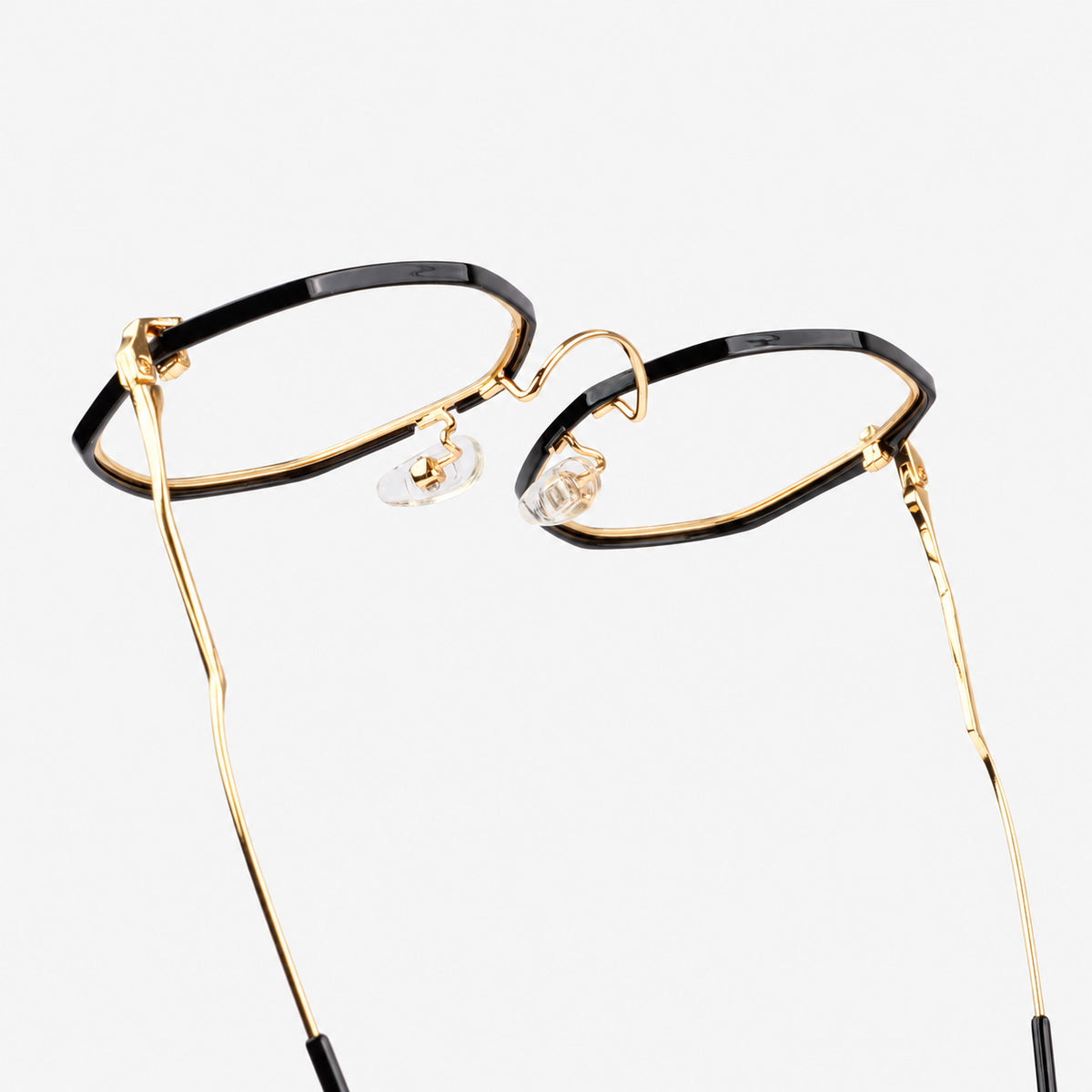 Gafas oftalmicas estilo poligonal en metal dorado con borde negro brillante Piclek