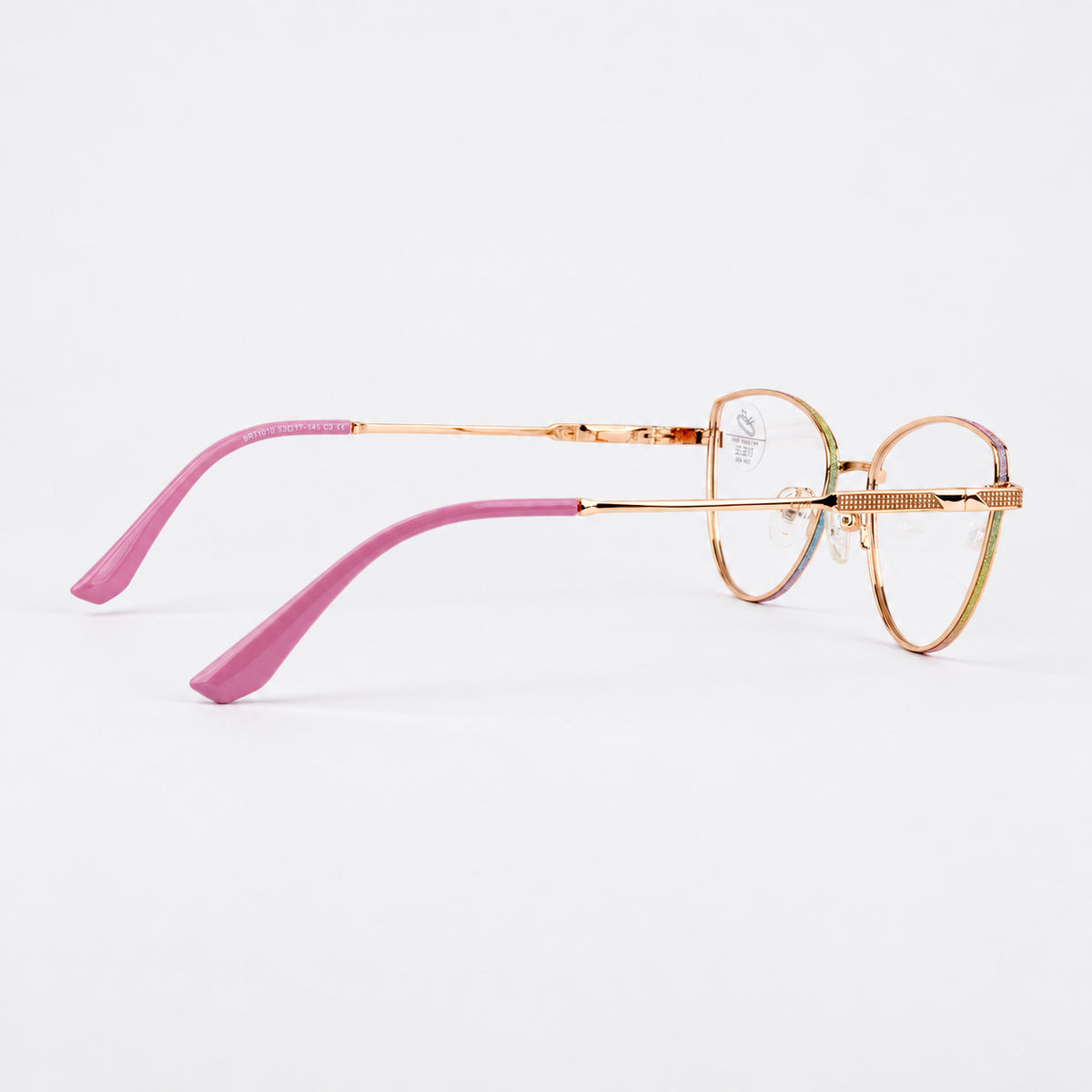 Perfil lateral de gafas de descanso mostrando varilla metalica dorada detalle texturizado y terminal fucsia Piclek