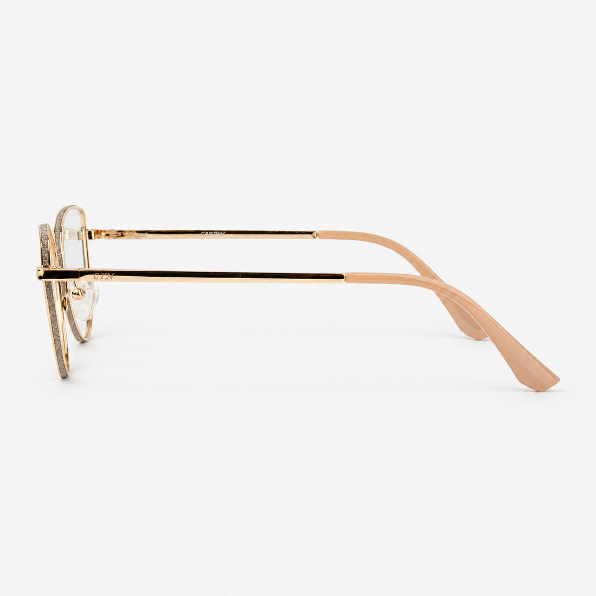 Perfil lateral de montura cat eye mostrando varilla metalica dorada y terminal beige Piclek