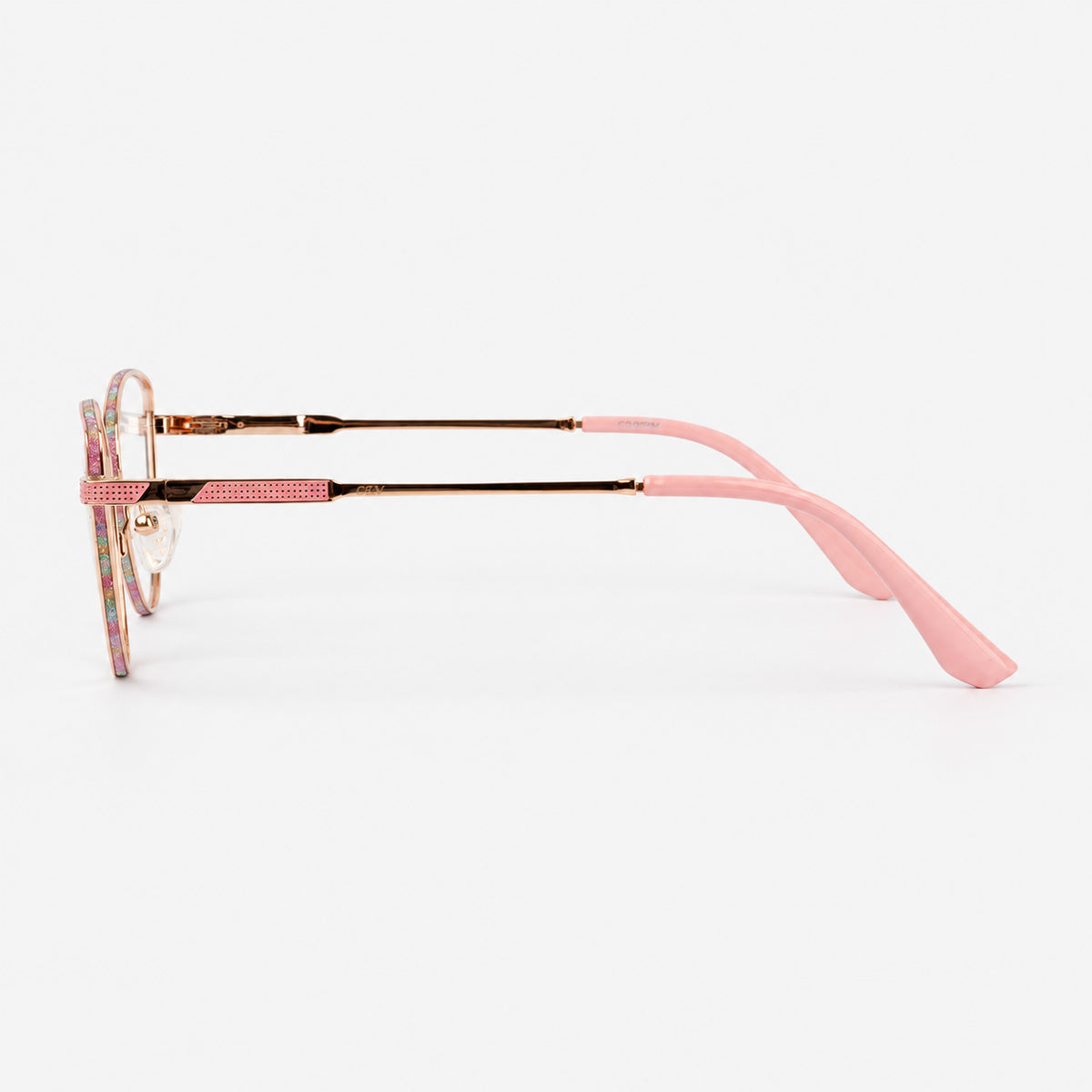 Perfil lateral de gafas de descanso mostrando varilla metalica oro rosa detalle glitter y terminal rosa Piclek