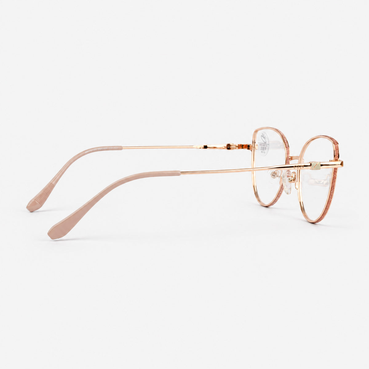 Perfil lateral mostrando varilla fina oro rosa y terminal nude en gafas de descanso Piclek