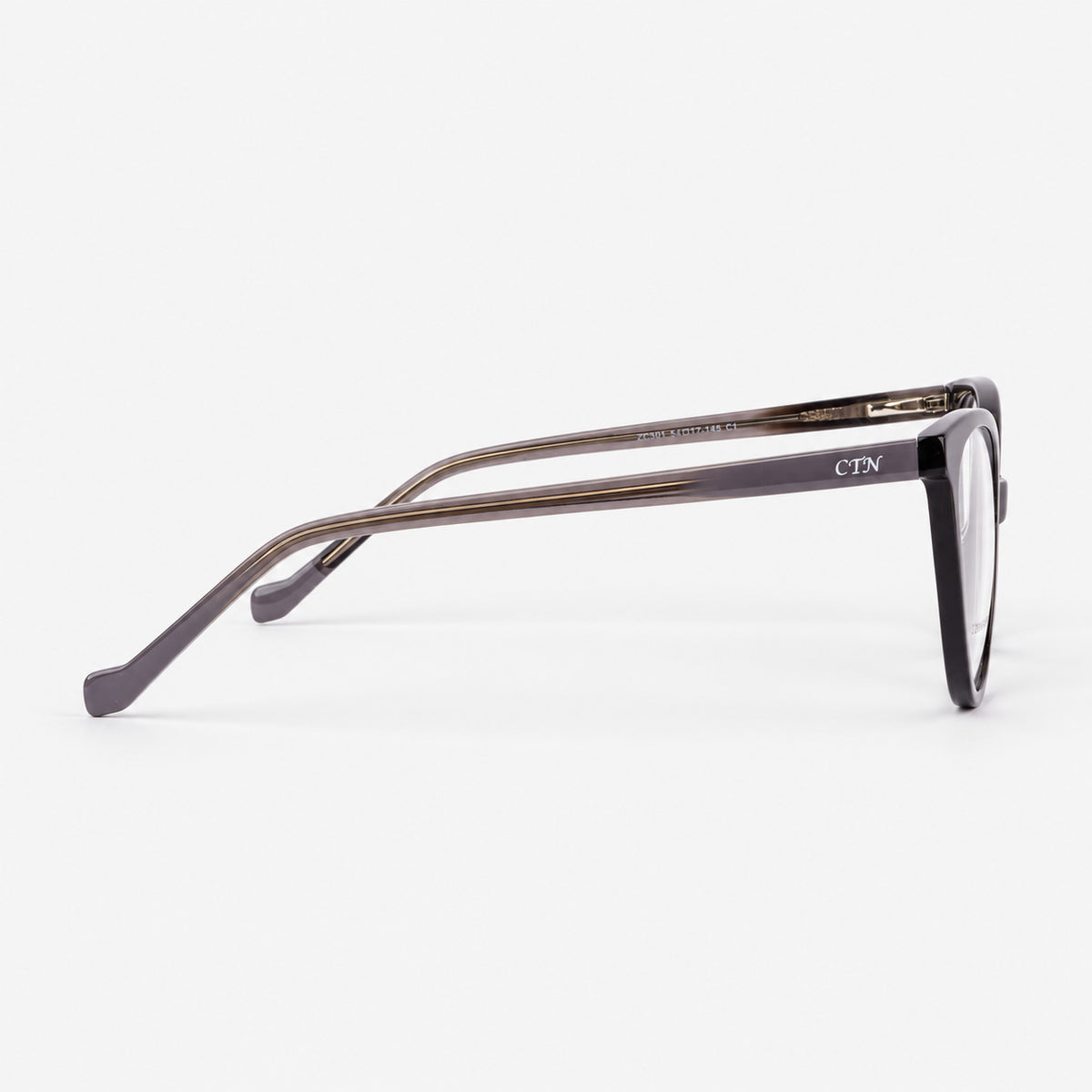 Perfil lateral de montura cat eye mostrando varilla gris translucida negra y alma metalica Piclek